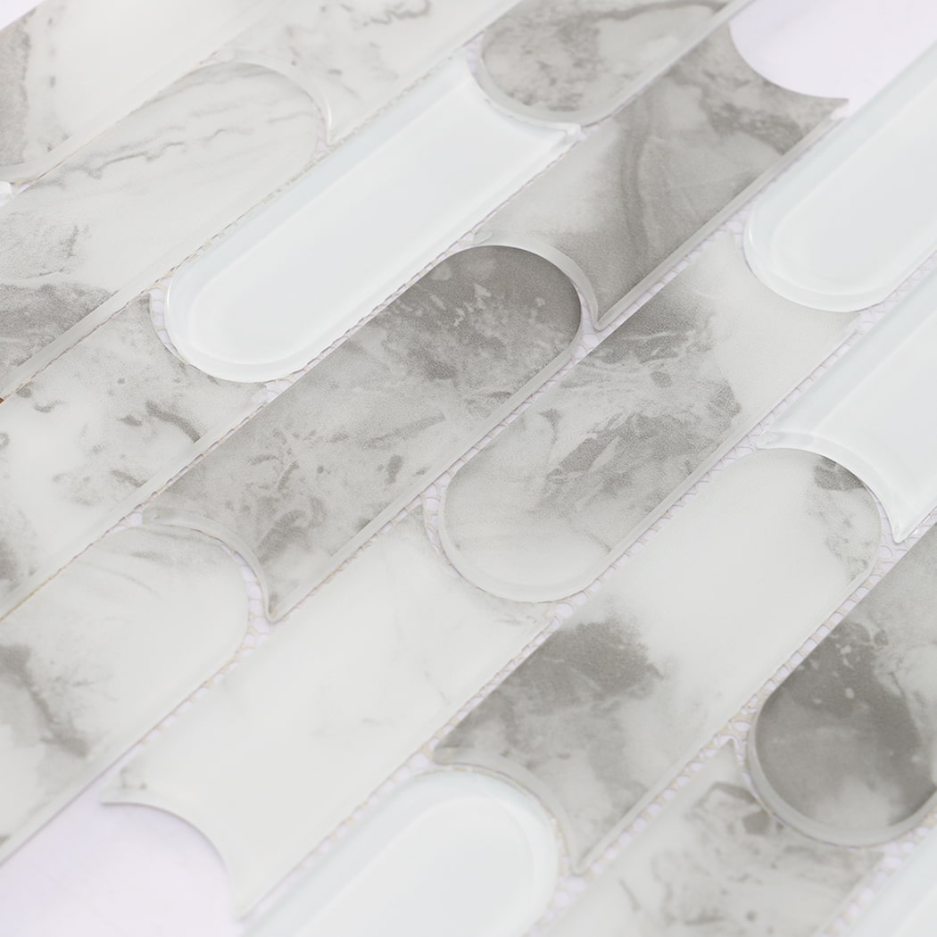 Gray marble and glossy white glass scalloped linear mosaic tile surface detail