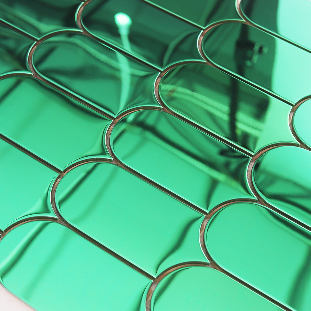 Green arch metal mosaic close up showing curved joints and glossy reflections