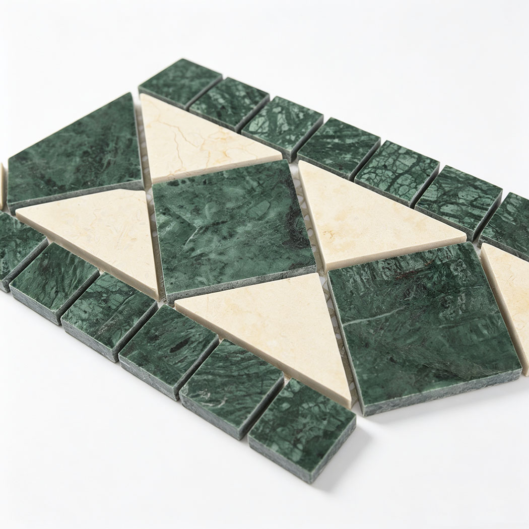 Close-up of green and cream marble geometric mosaic tile pieces