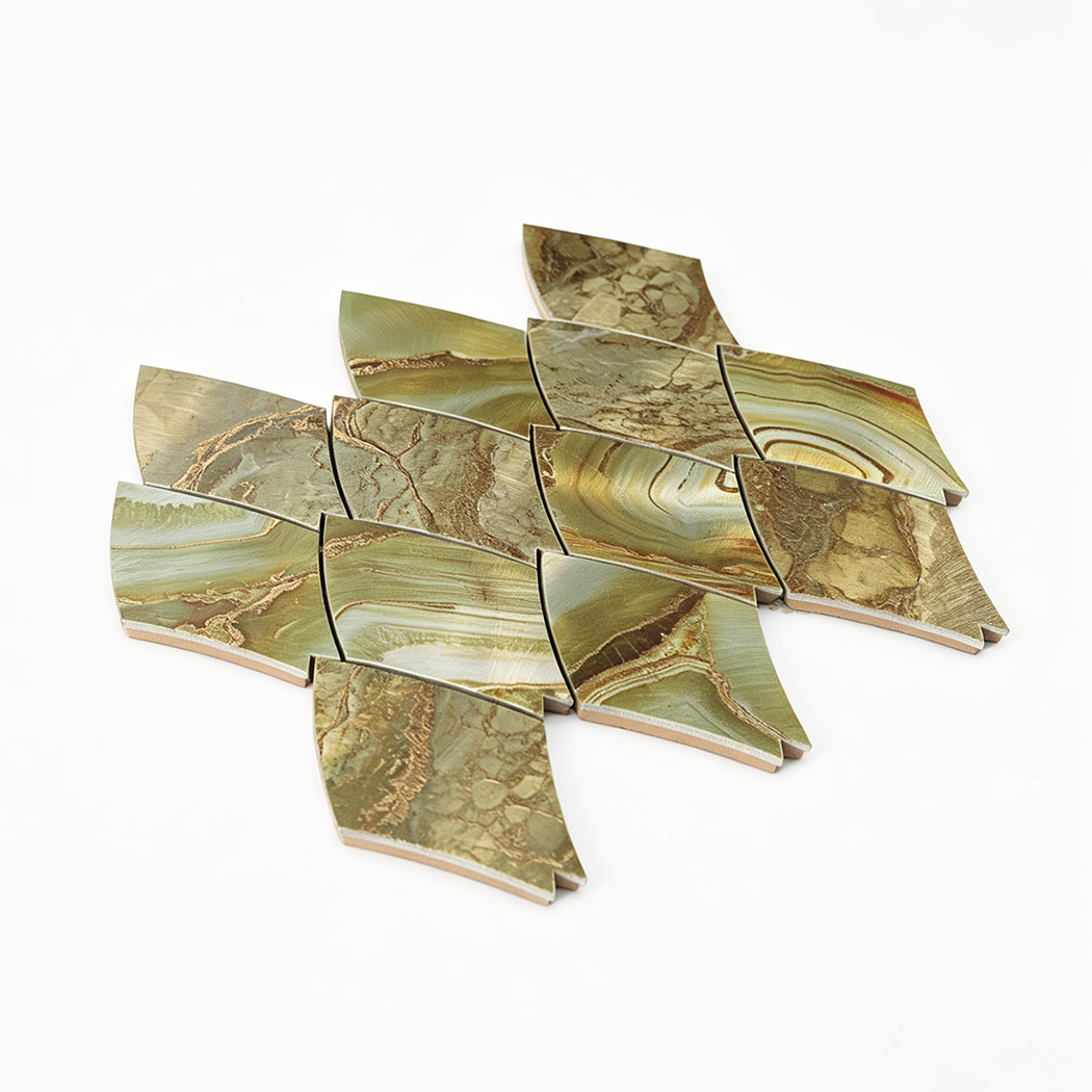 Angled view of green gold feather aluminum mosaic tile sheet on a white background
