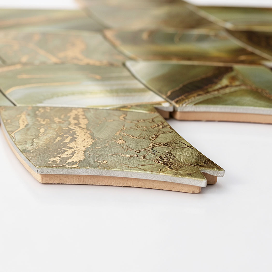 Low-angle view of green gold feather aluminum mosaic tiles showing layered construction