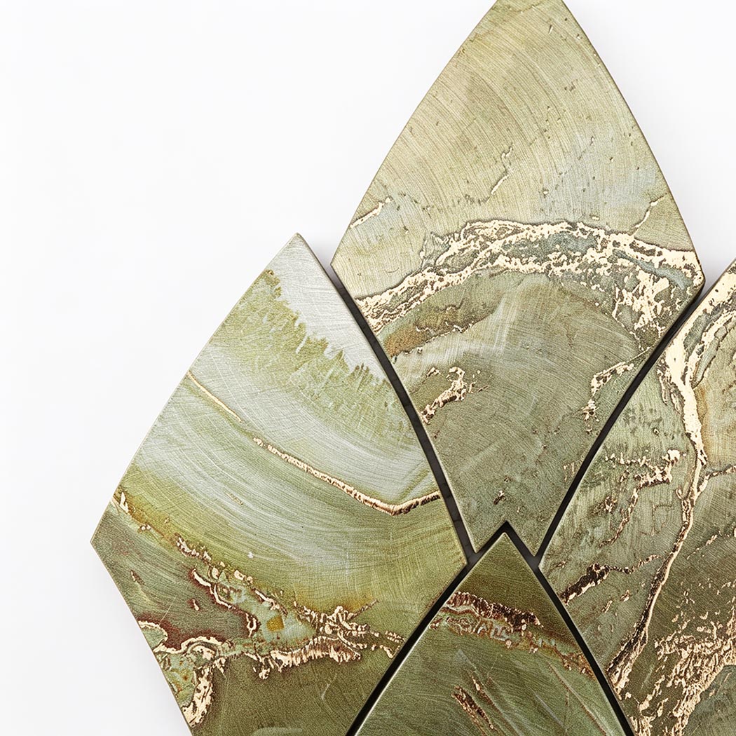 Close-up of green and gold feather aluminum mosaic tiles with marble look veining