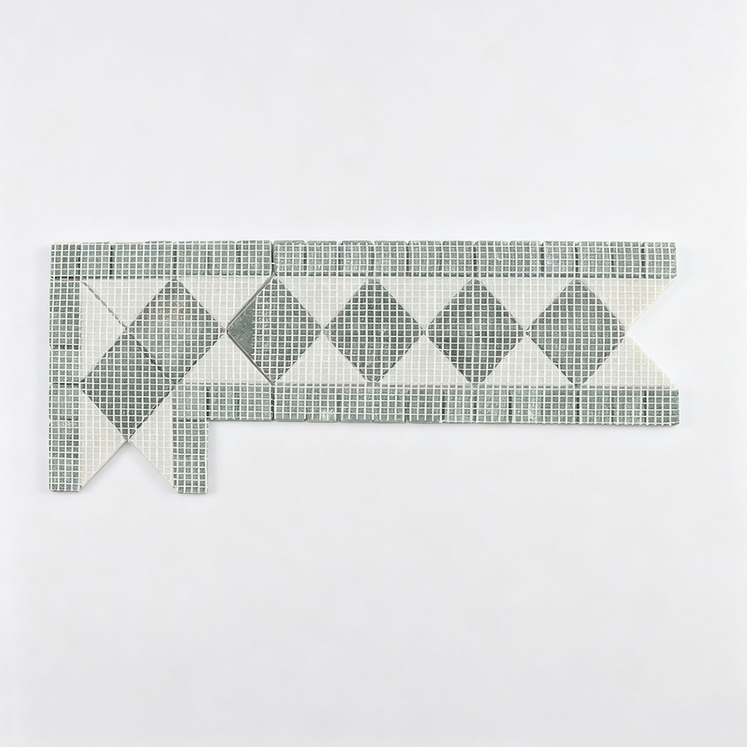 Back view of green marble and white triangle mosaic border on mesh