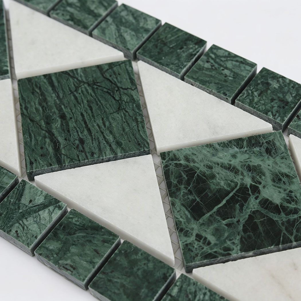 Detailed view of green marble square and white triangle mosaic pattern