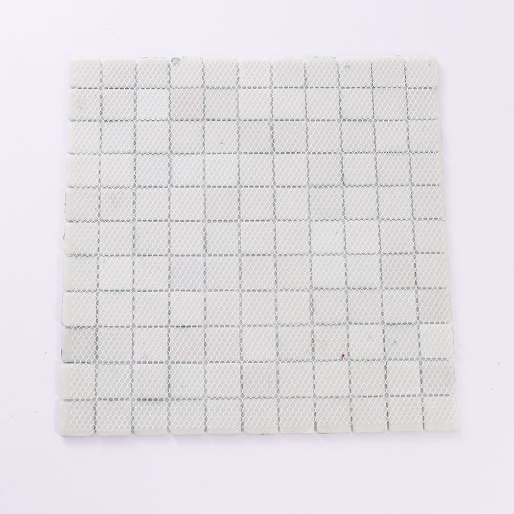 Back view of green recycled glass mosaic tiles showing mesh backing.