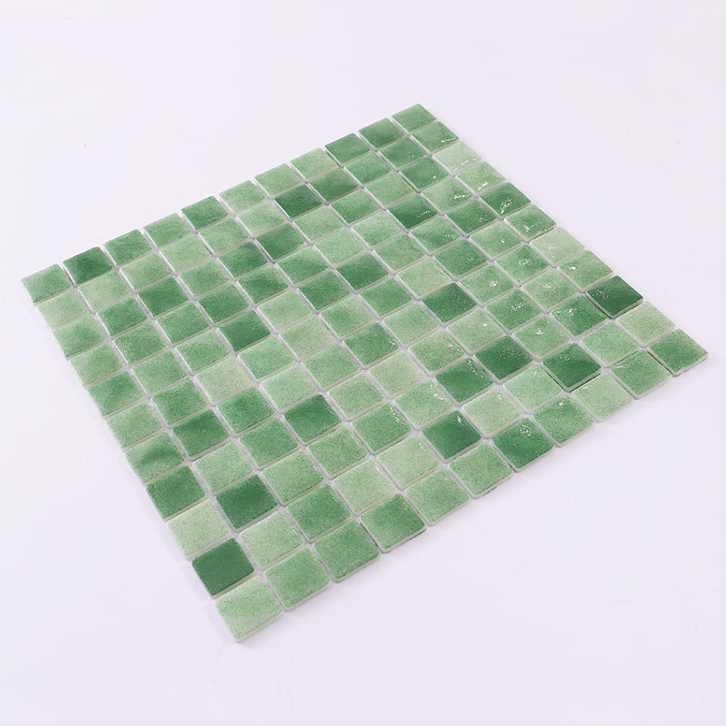 Angled display of a green recycled glass mosaic tile sheet.