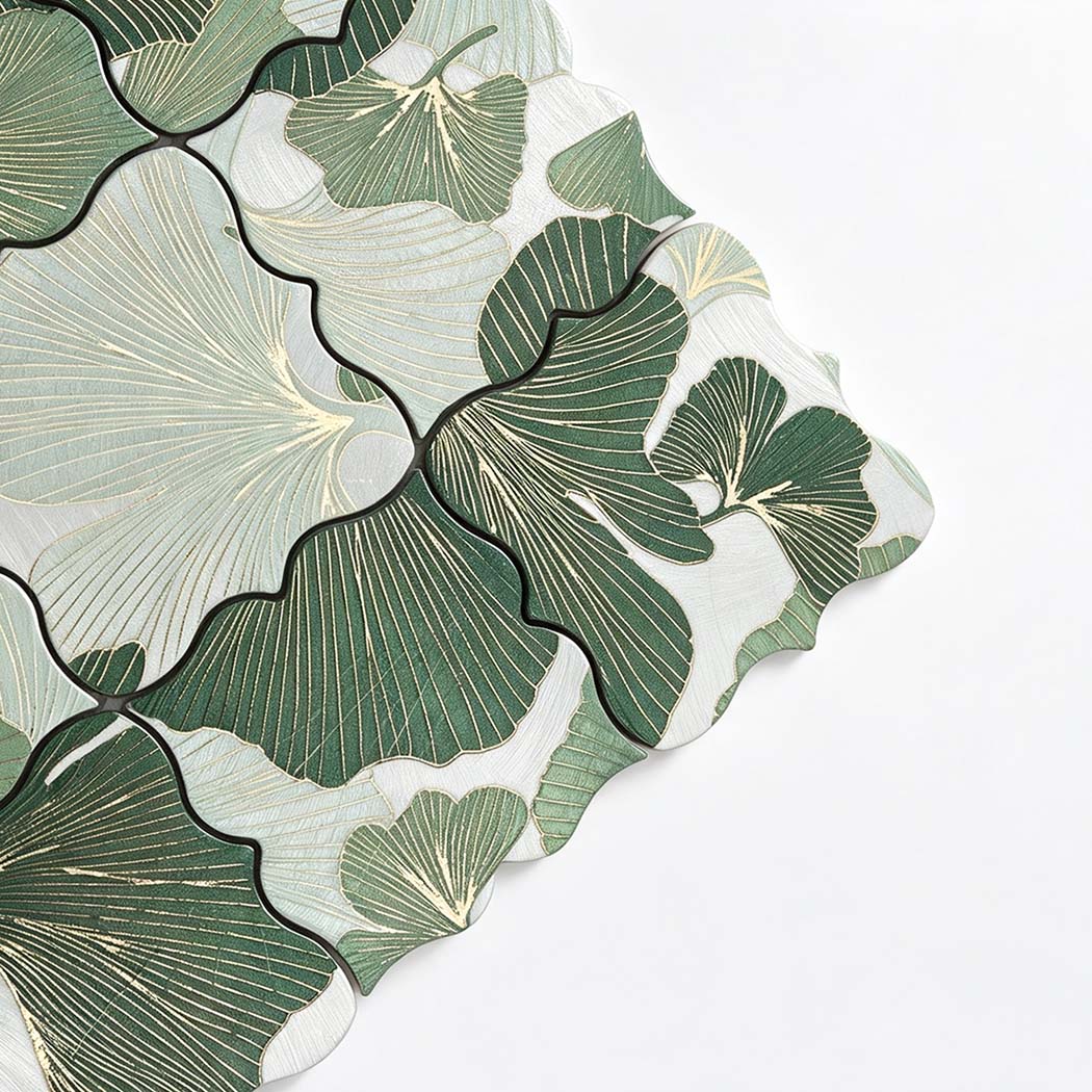 Close-up of green and silver floral aluminum mosaic tile with engraved petal texture