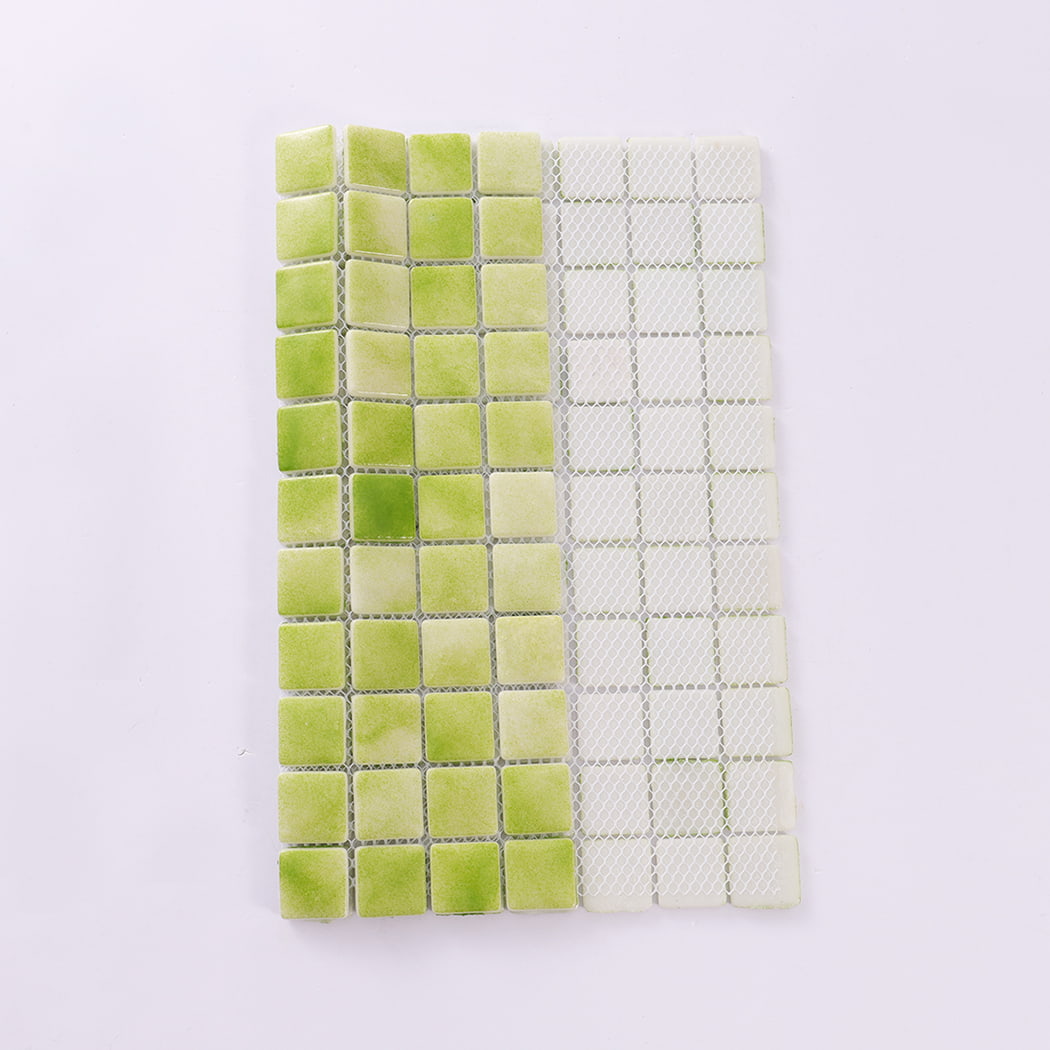 Backside view of green recycled glass mosaic tile sheet with mesh backing
