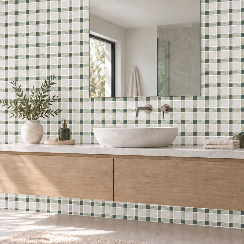 Green and white plaid marble mosaic tile behind a floating wood bathroom vanity