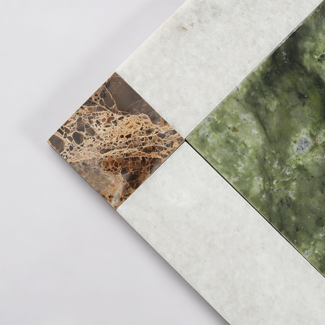 Green marble center and white border detail of square mosaic tile