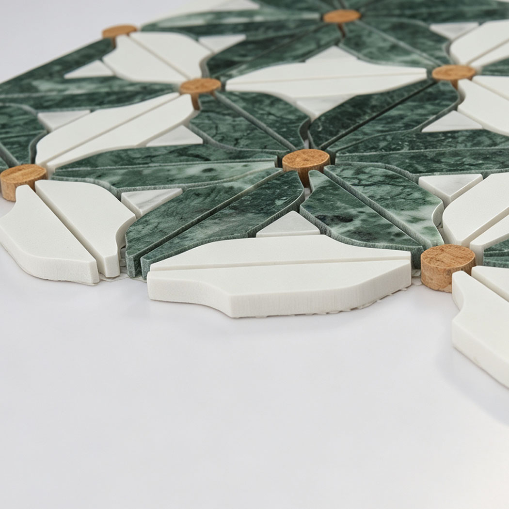 Side view of green and white marble floral mosaic tile with golden accents