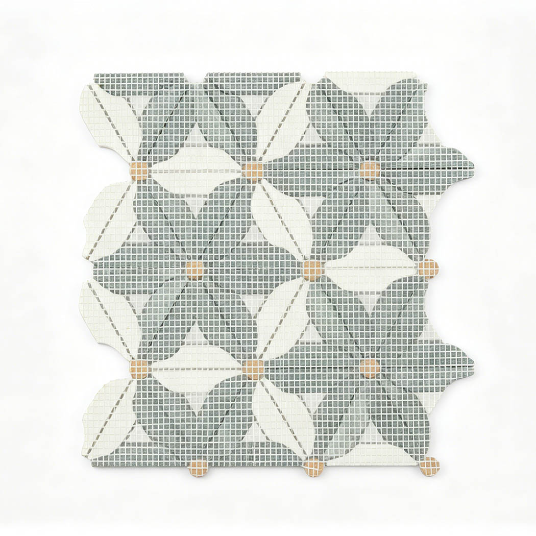 Mesh backing of green and white marble floral mosaic tile with golden accents