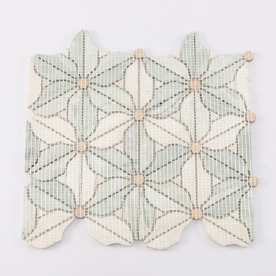Back view of green and white daisy marble mosaic tile with mesh backing