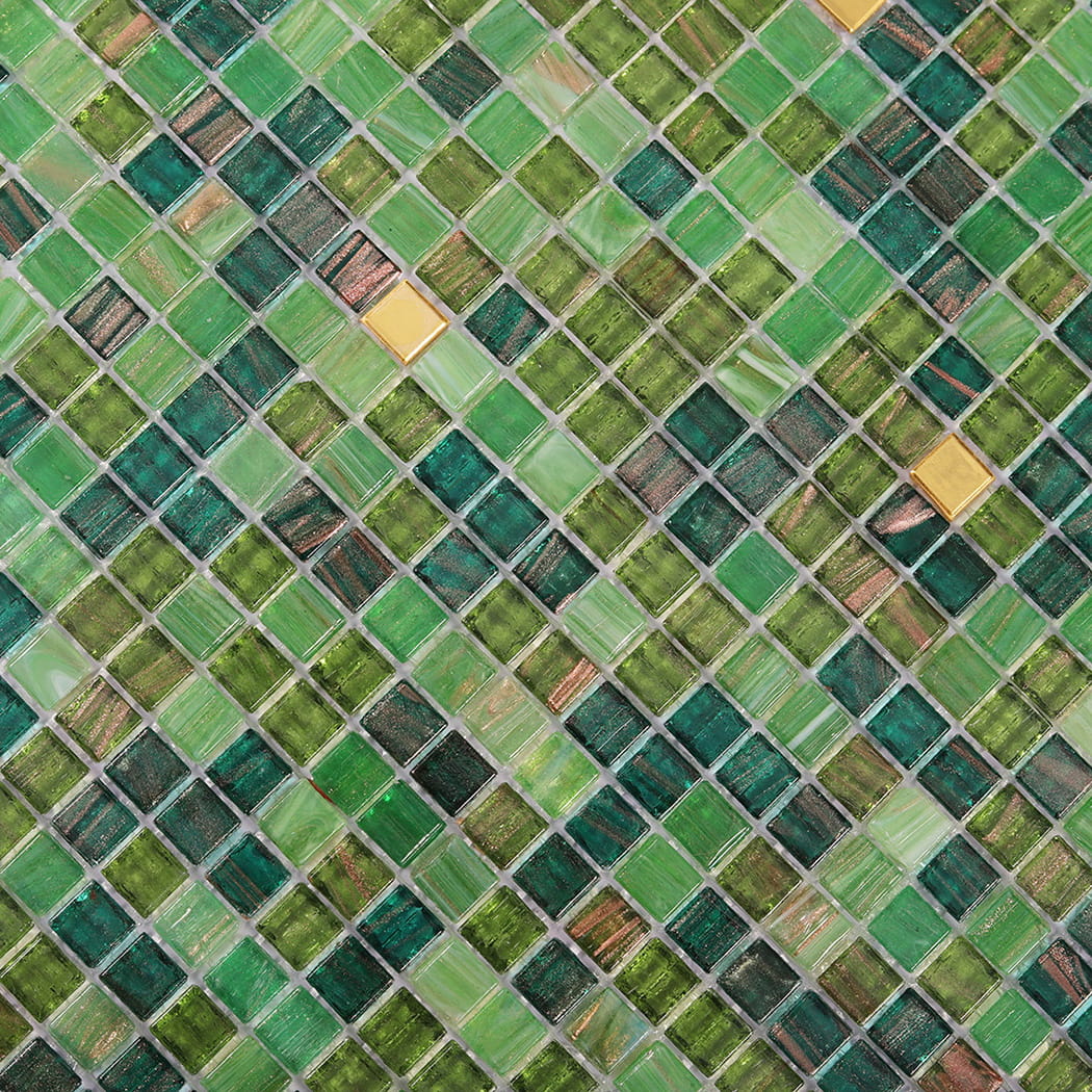 Close up texture of green mixed glass mosaic tiles with varied shades