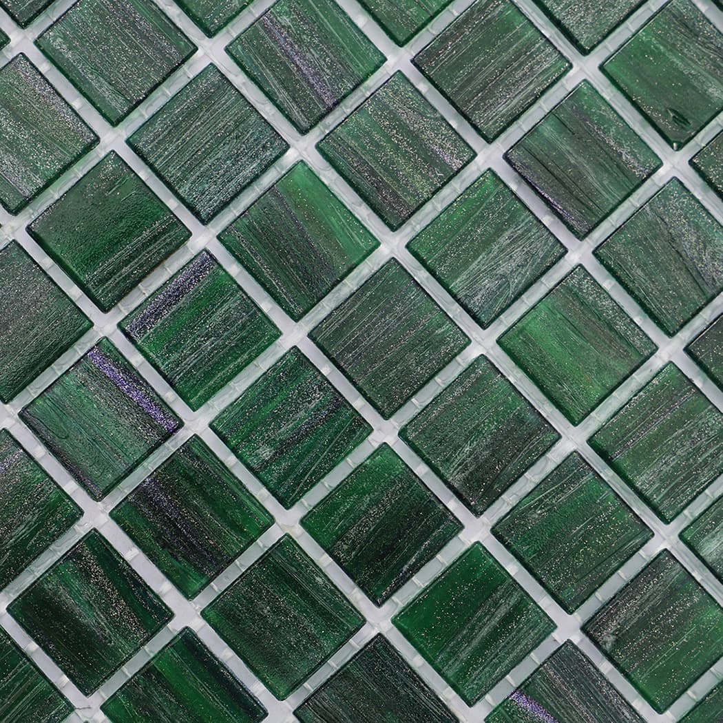 Diagonal view of green glass mosaic tile highlighting grid arrangement