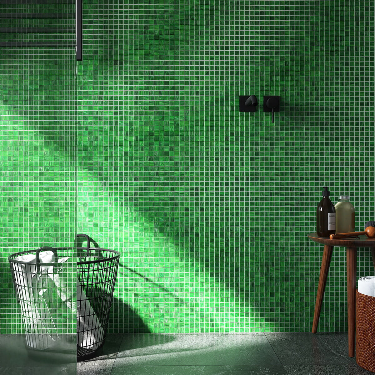 Green mosaic tiles covering a bathroom wall, featuring a modern design with minimalist decor