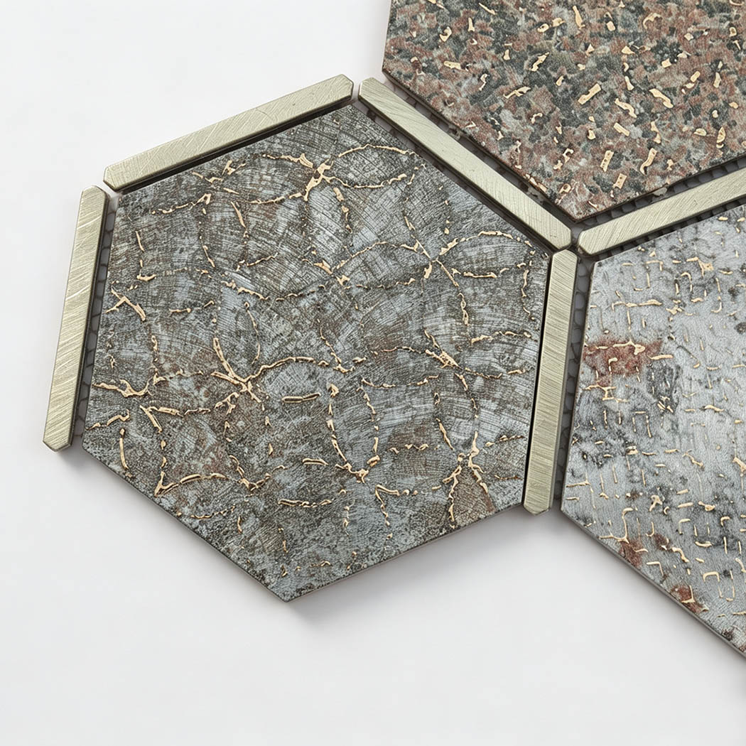 Close-up of grey aluminum hexagon mosaic tiles with gold veining