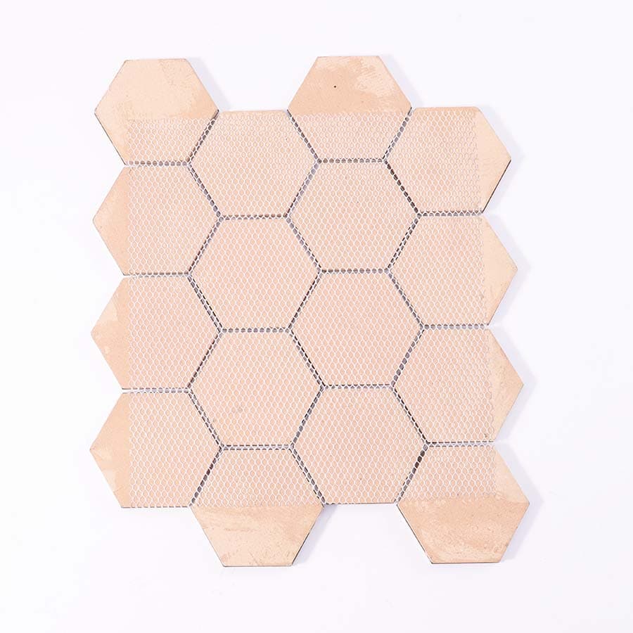 Back view of grey hexagon aluminum mosaic tile sheet with mesh backing