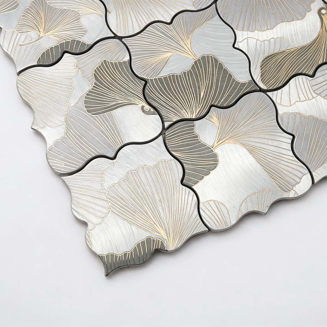 Close-up of grey and silver floral aluminum mosaic tile with engraved petal texture