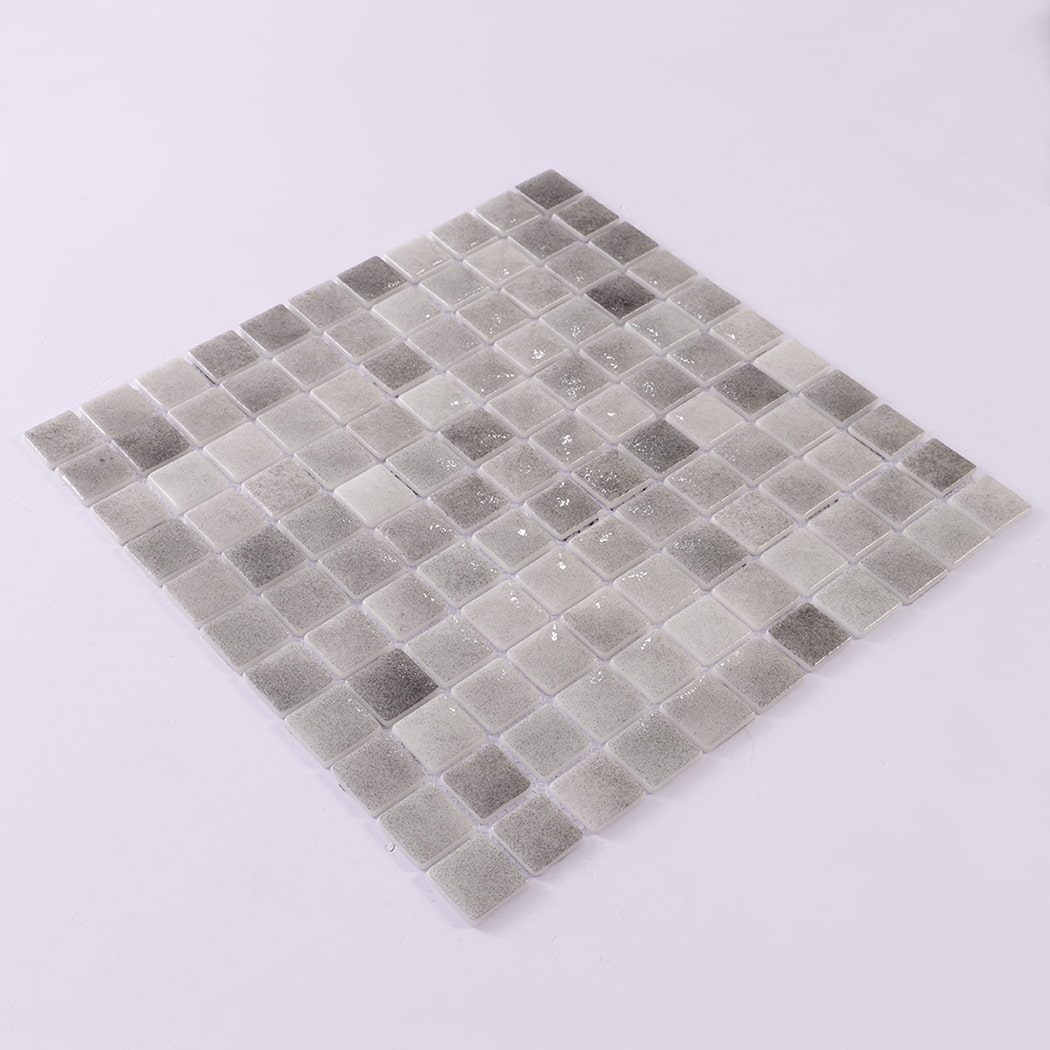 Angled view of grey recycled glass mosaic tile sheet