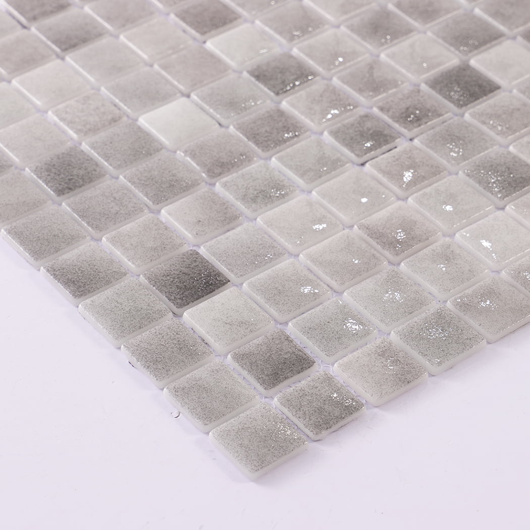 Detail view of wet grey recycled glass mosaic tiles