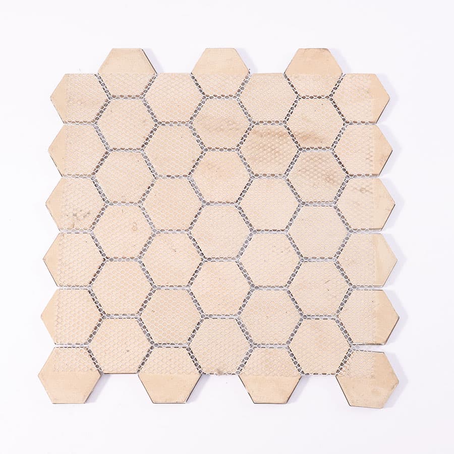 Back view of hexagon aluminum mosaic tile sheet with mesh backing for easy installation.