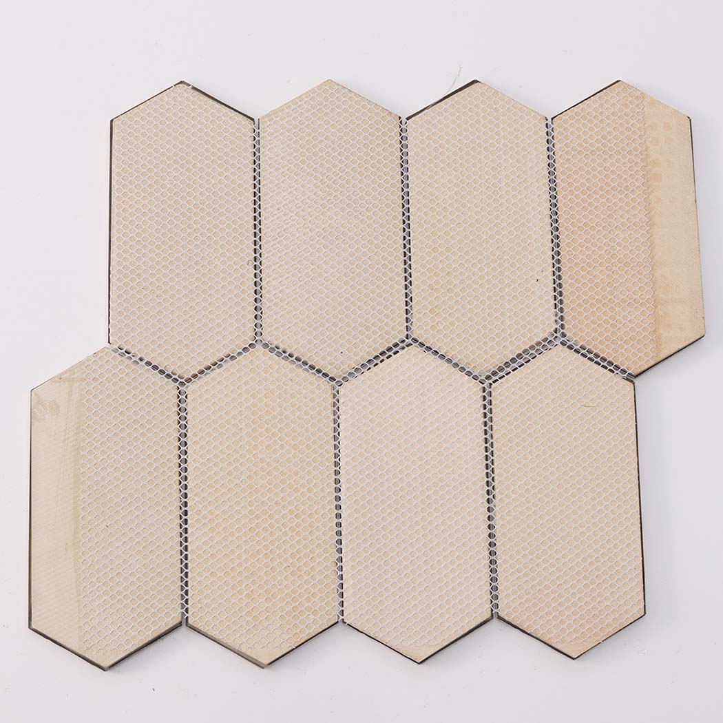 Beige mesh backing of hexagon metal mosaic tiles shown in rear view sheet format