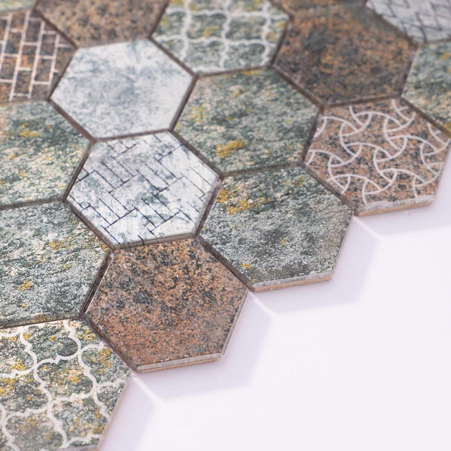 Angled side view of aluminum hexagon mosaic tiles showing color variation and tile thickness.