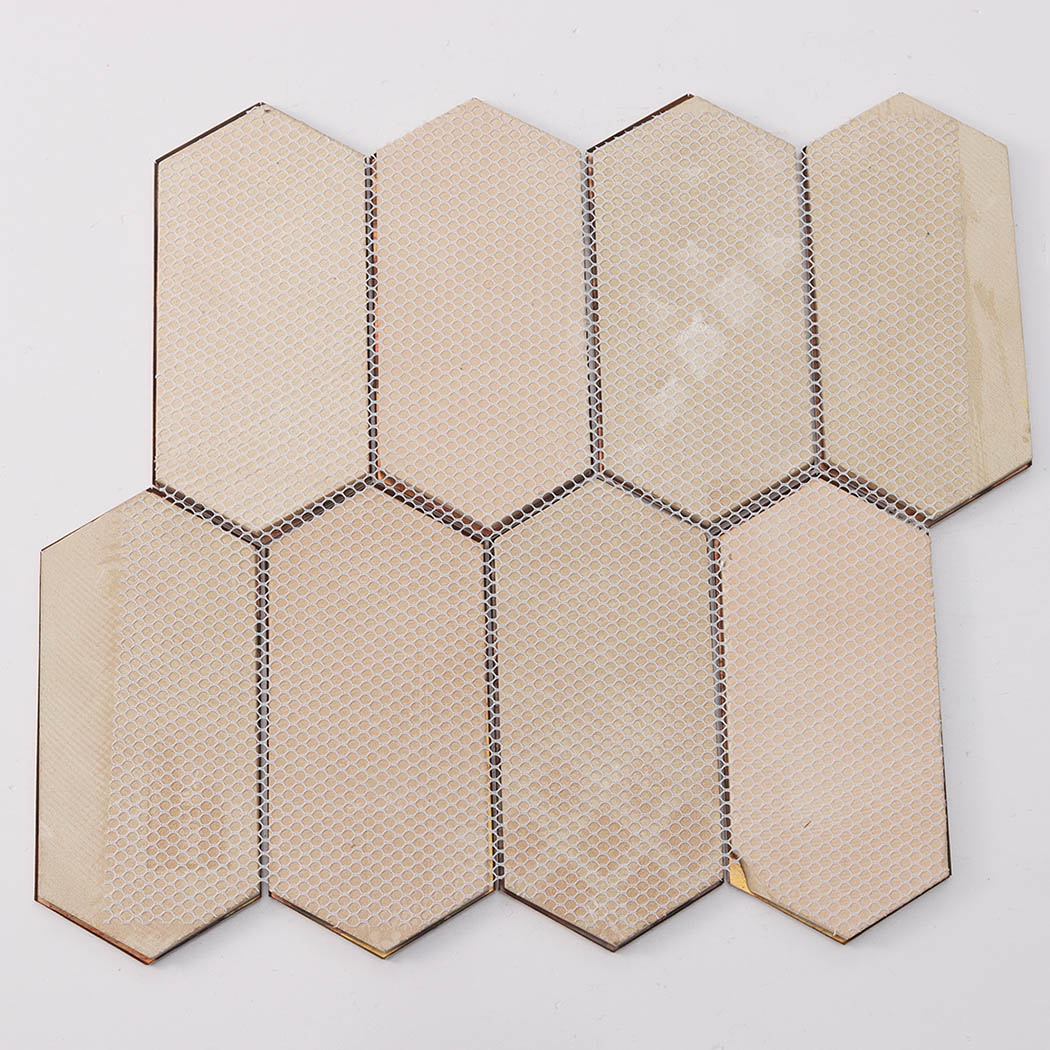 Back view of hexagon mosaic tile showing mesh mounted backing and substrate detail