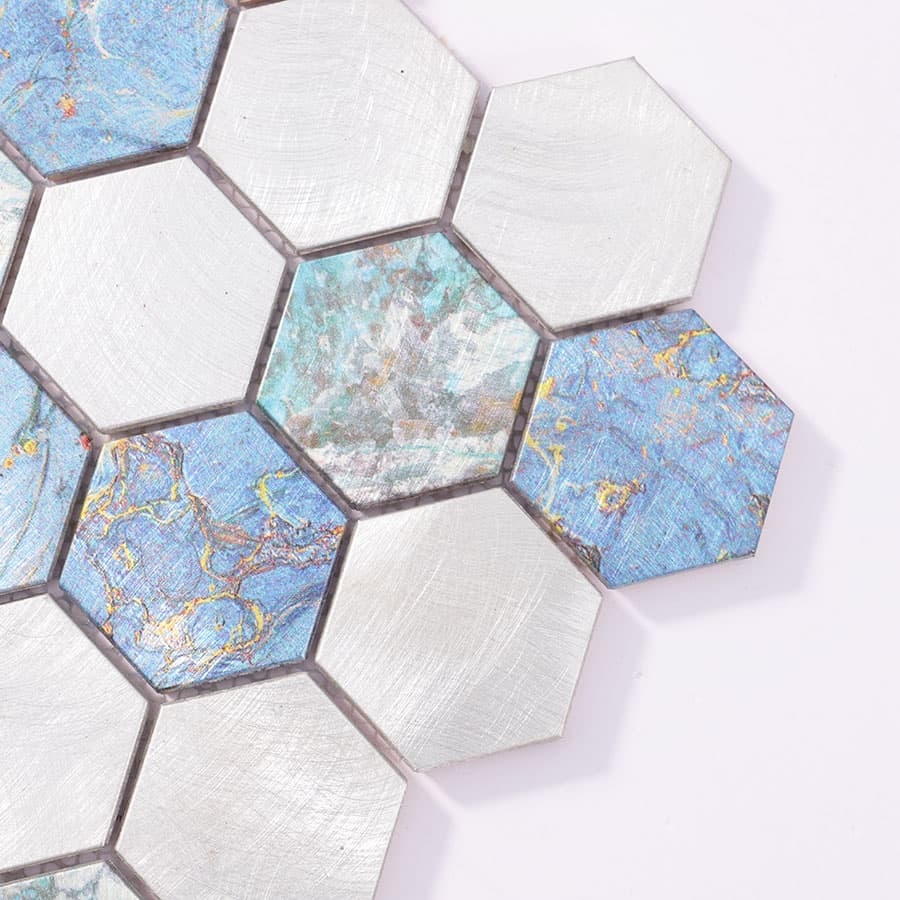 Close-up of hexagon tile corner showing brushed metal texture and oxidized color variation.