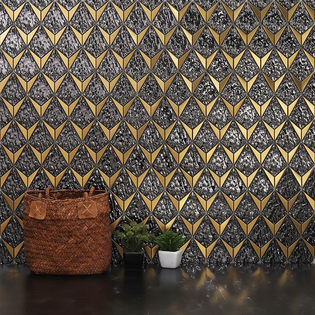 A modern home interior setting featuring a striking black and gold mosaic tile backsplash wall.