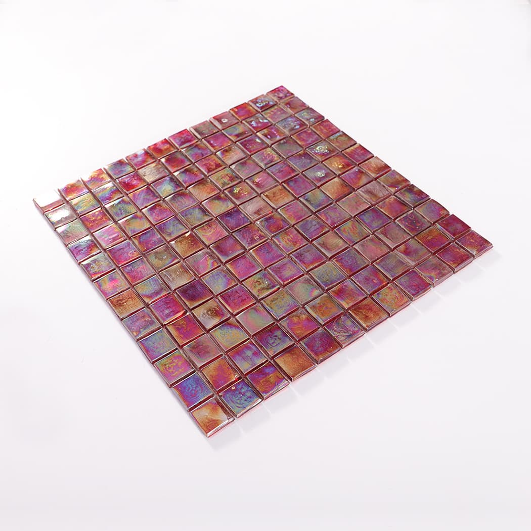 Perspective view of iridescent glass mosaic tile sheet placed on white background