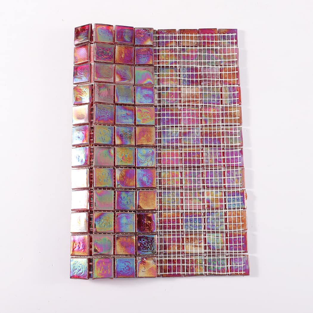 Iridescent glass mosaic sheet showing front tiles and white mesh backing side by side