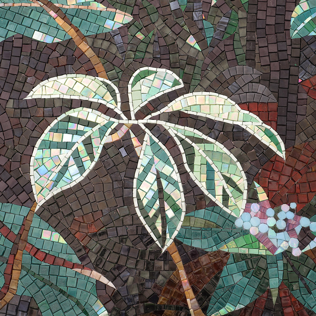 Forest mosaic mural detail with iridescent green leaves and dark background