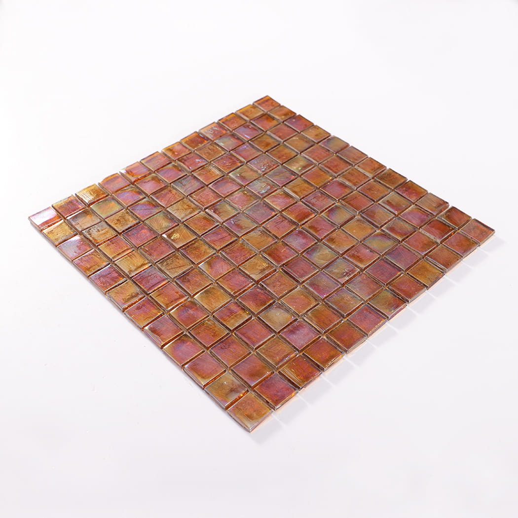Perspective view of an iridescent amber square glass mosaic tile sheet.