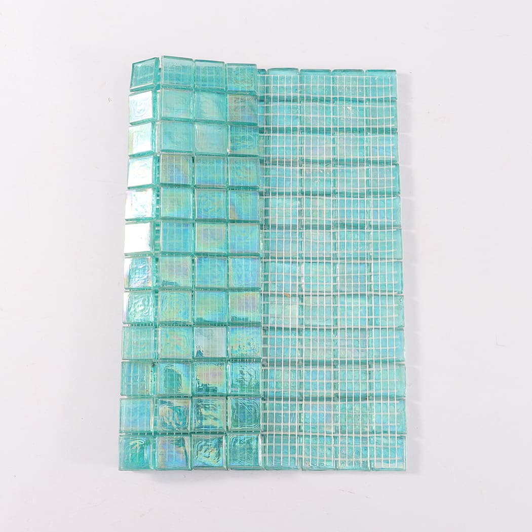 Iridescent aqua square glass mosaic tile sheet with mesh backing shown.