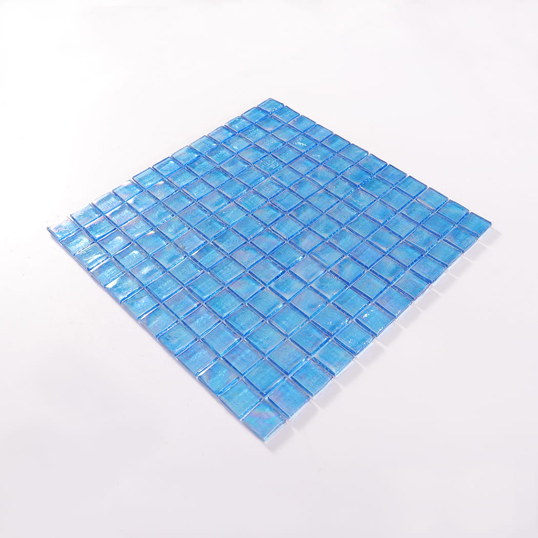 Perspective view of an iridescent blue square glass mosaic tile sheet.