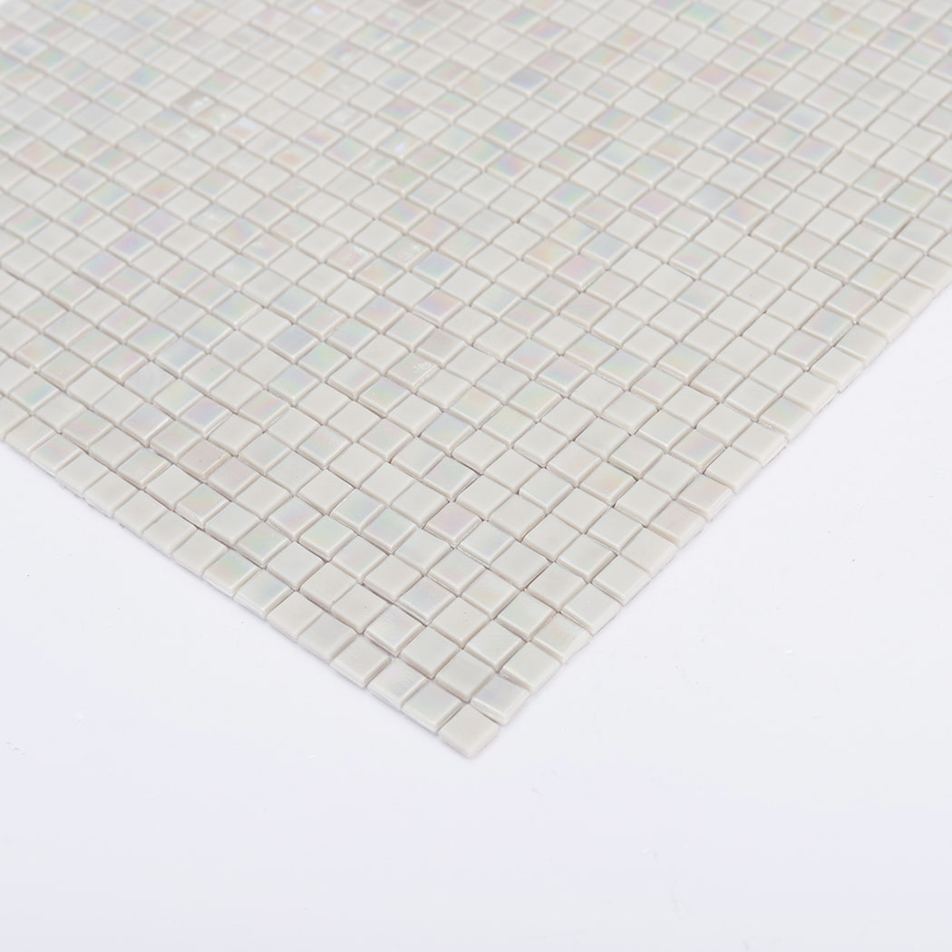 Angled edge shot of iridescent light gray water glass mosaic tile sheet