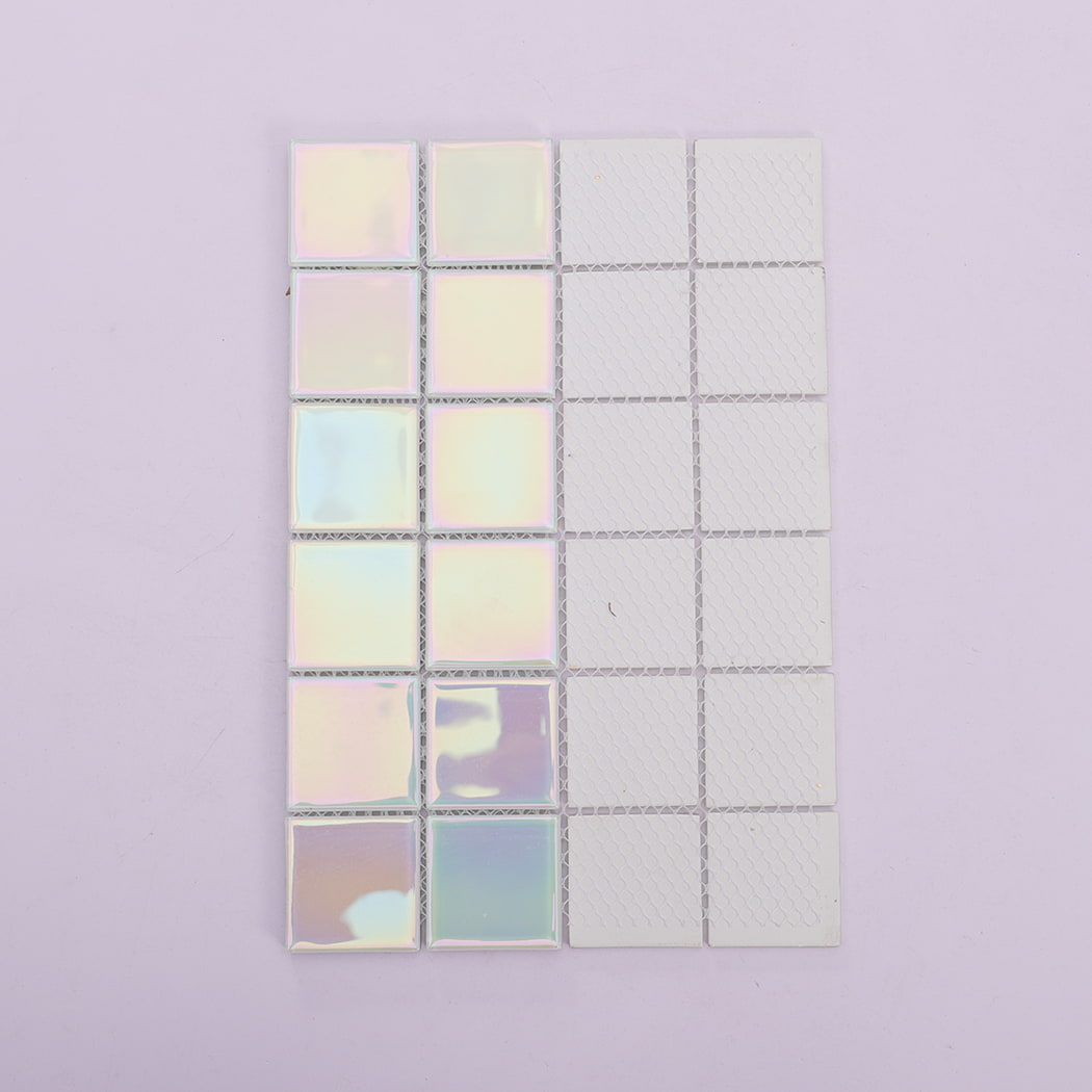 Comparison of front iridescent surface and white mesh backing of mosaic tile sheet.