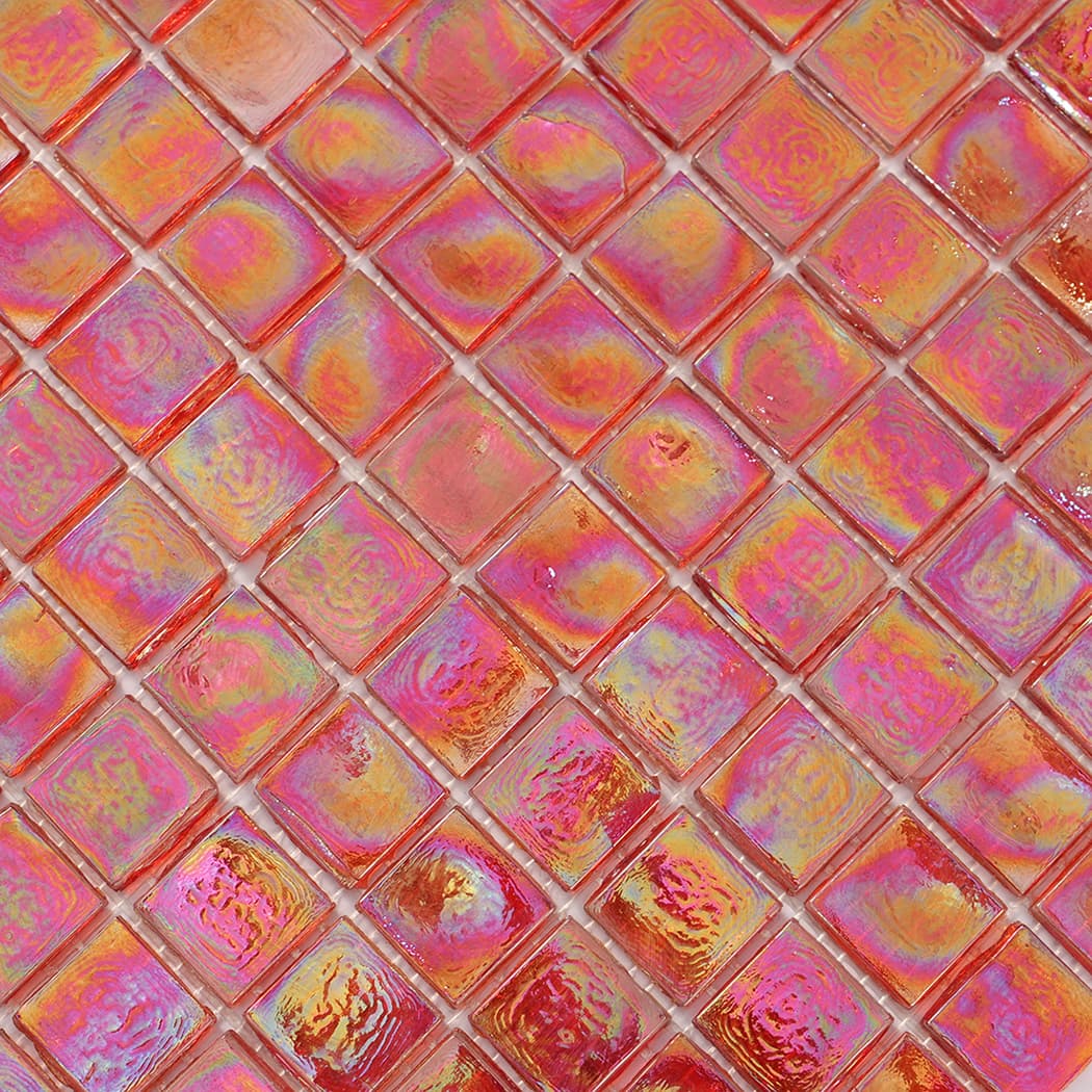 Close up of iridescent red glass mosaic tile surface and grout lines.