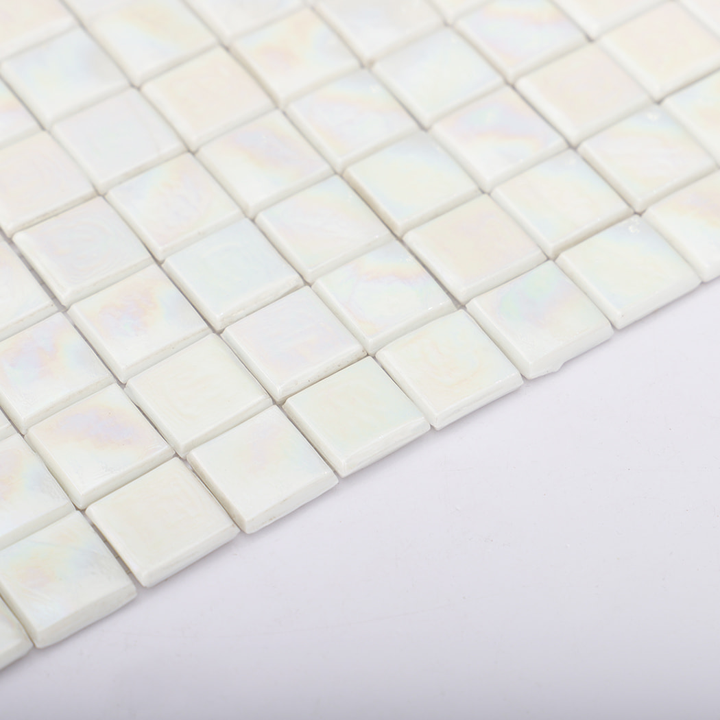 Side angle showing edge thickness of iridescent white mosaic tile sheet.