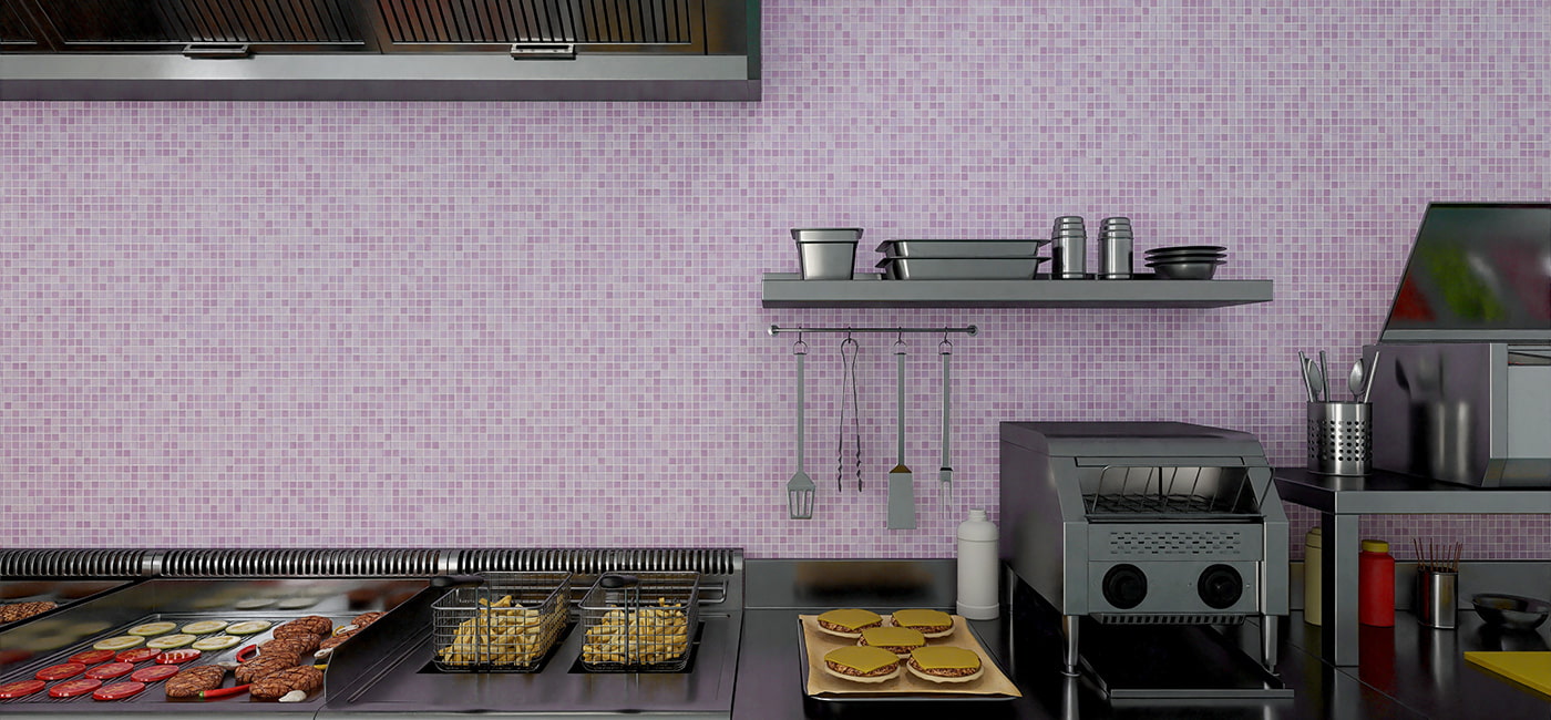 Wide kitchen view with grill station and fryer baskets against a purple mosaic backsplash