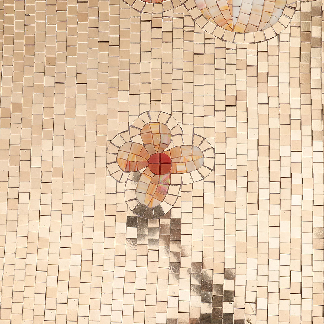 Large floral glass mosaic mural detail with orange and purple flowers
