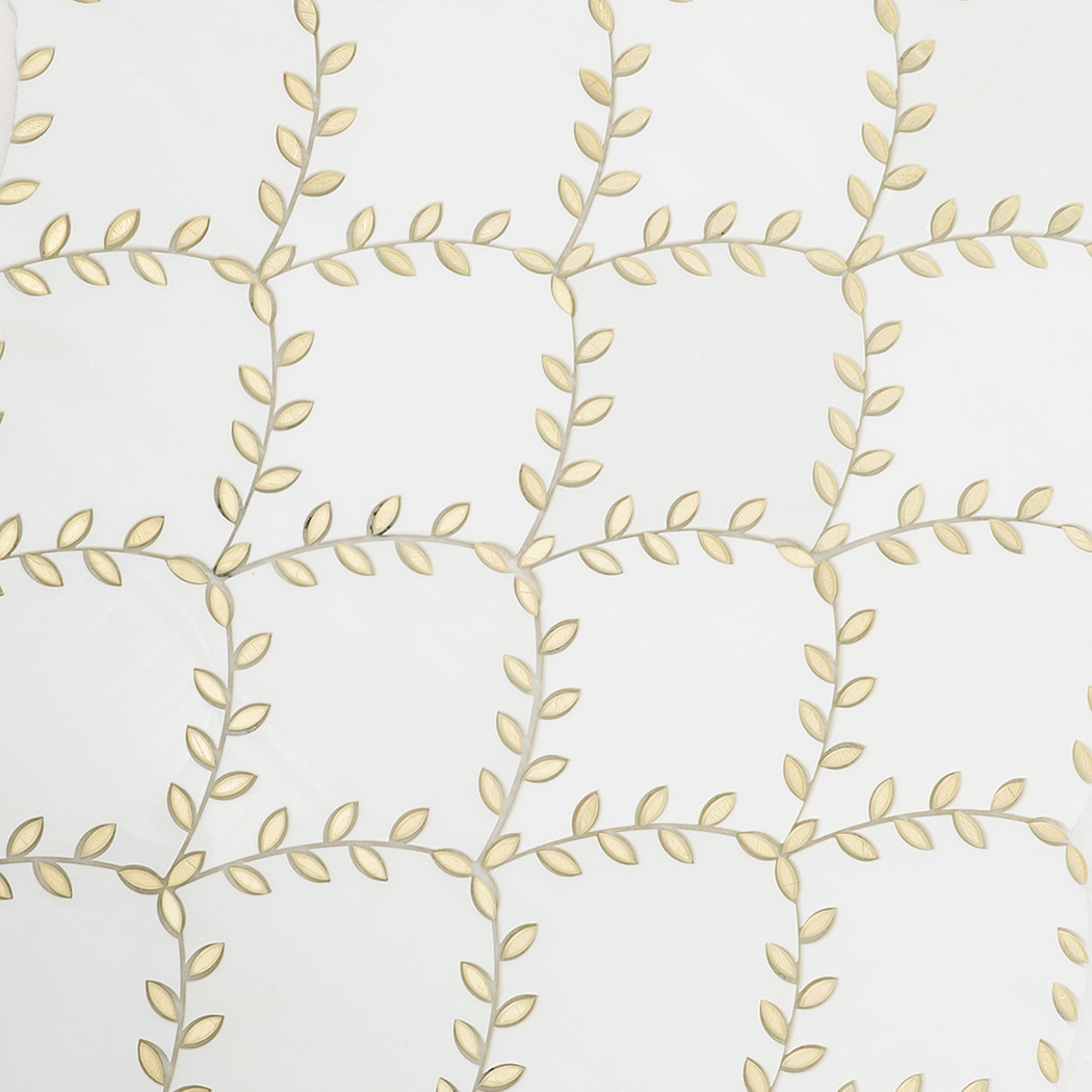 Mosaic layout showing repeated gold leaf patterns on marble tiles.