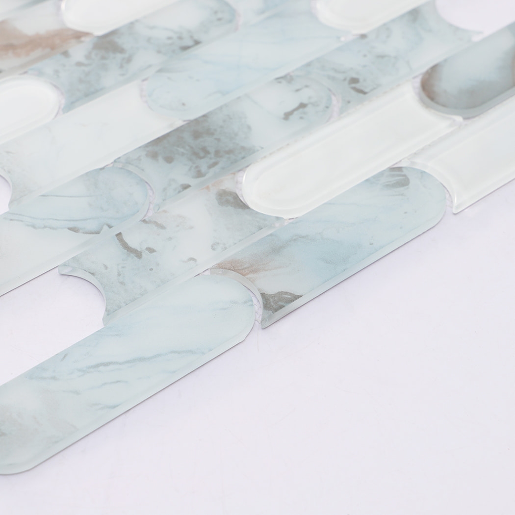 Detailed view of light blue beige and white pill shaped glass mosaic pattern