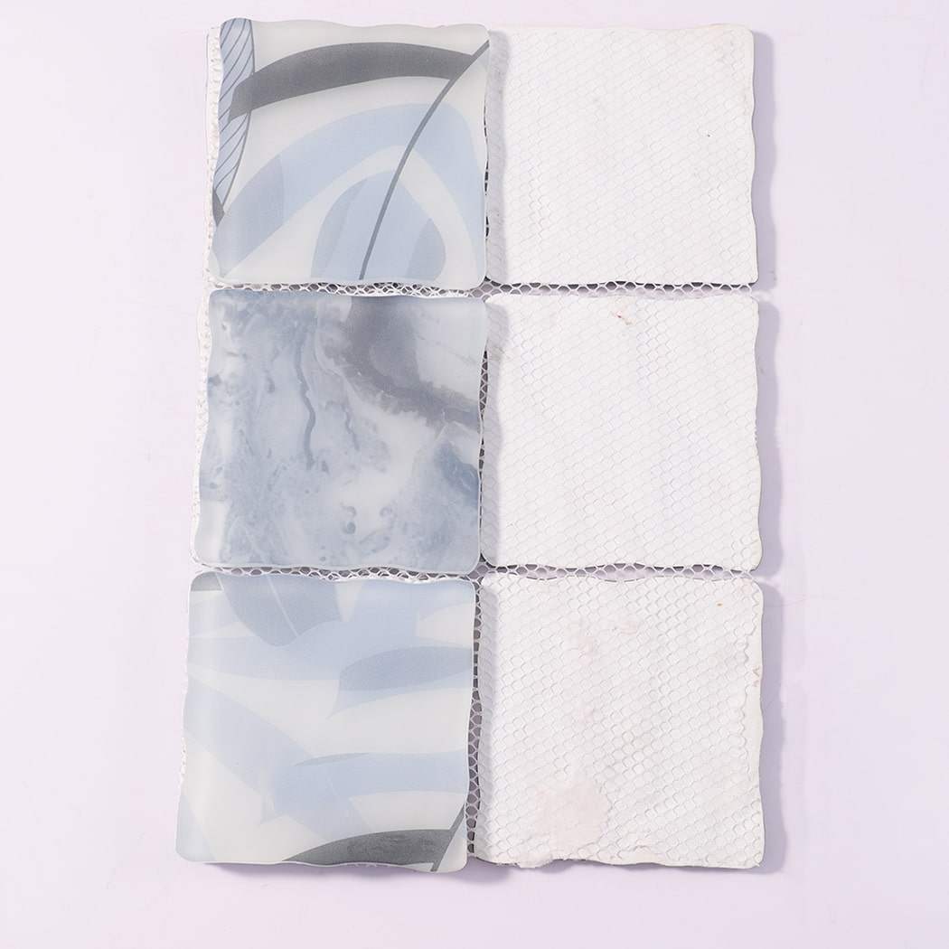 Back view of light blue gray wavy square glass mosaic tiles with mesh backing