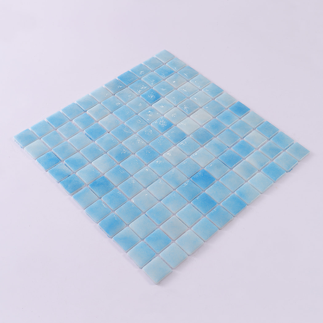 Angled view of light blue recycled glass mosaic tile sheet