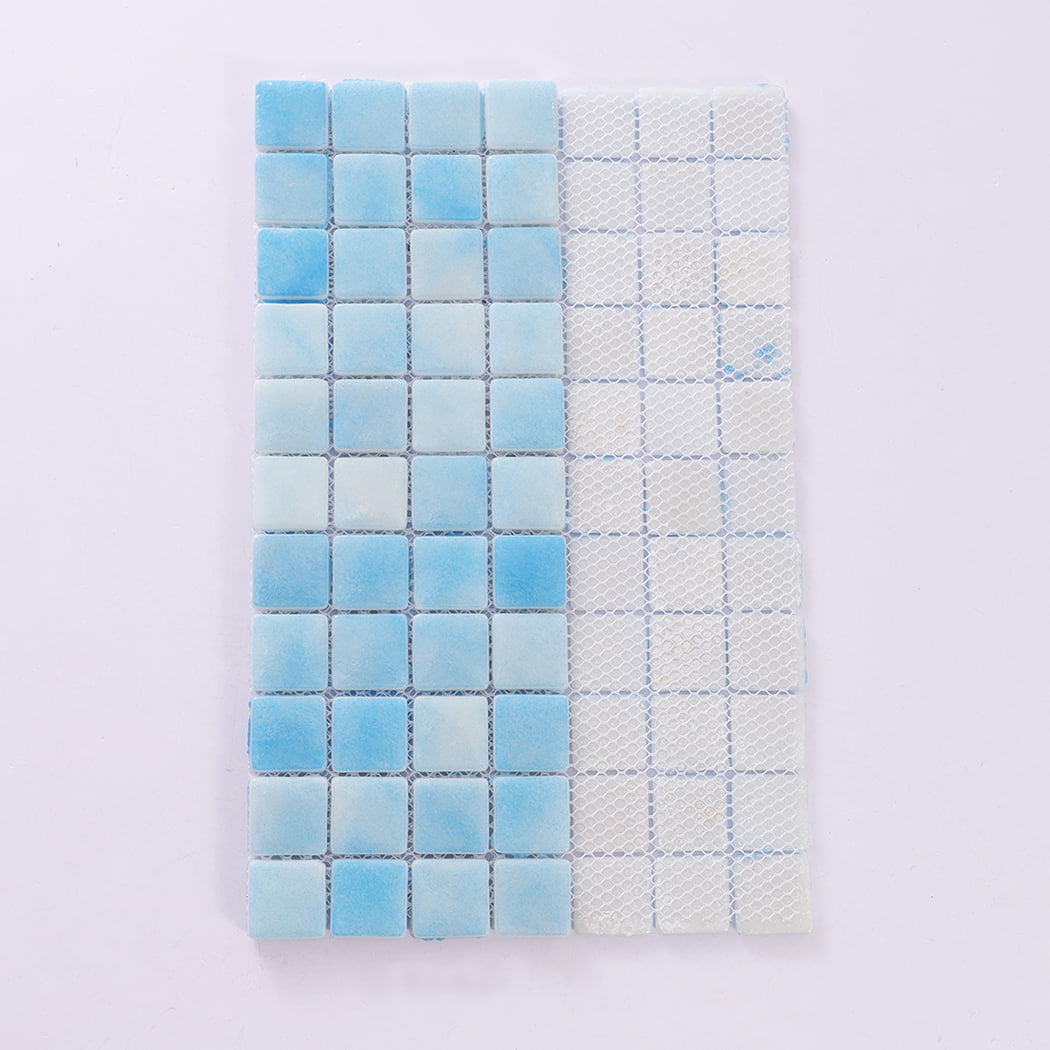 Backside view of light blue recycled glass mosaic tile sheet with mesh backing