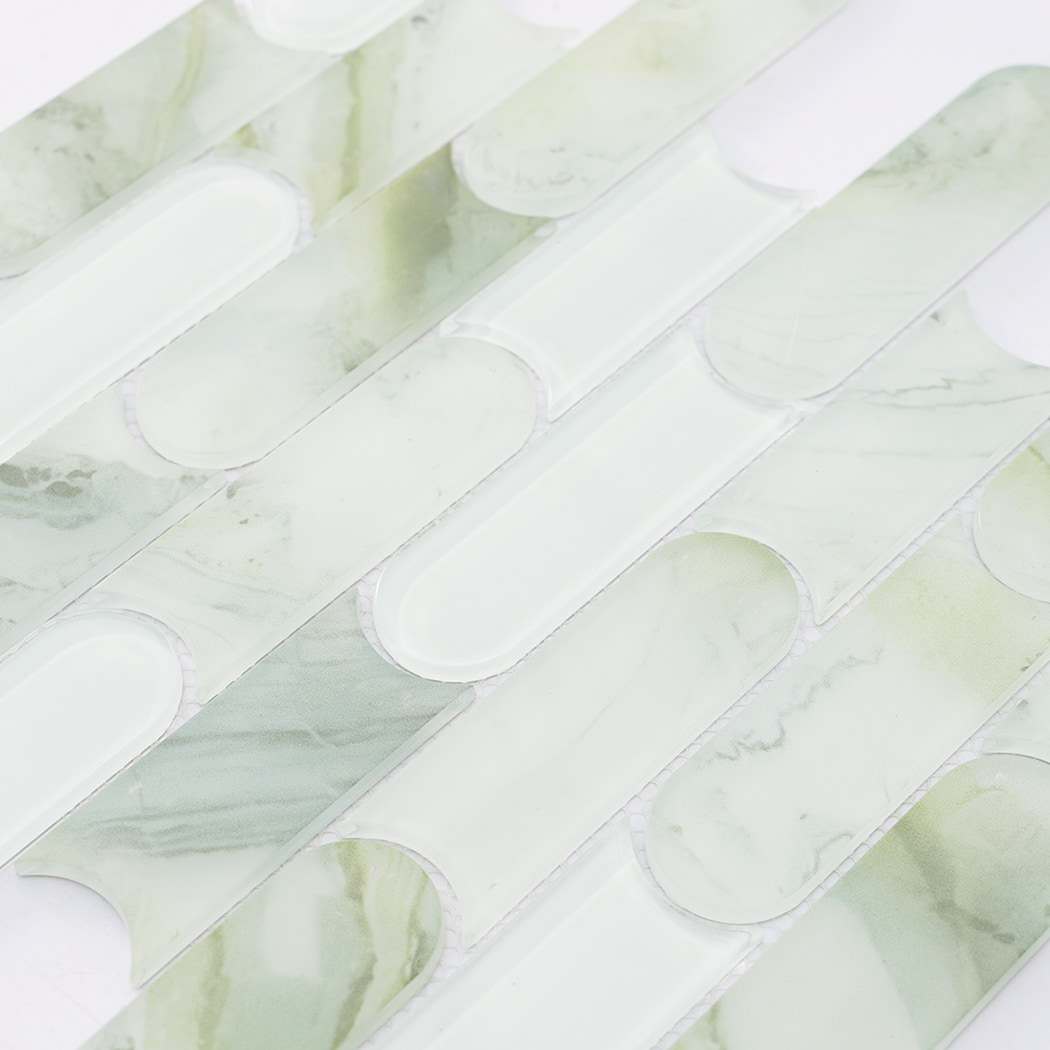 Light green marble and white glass mosaic tile surface with interlocking linear design