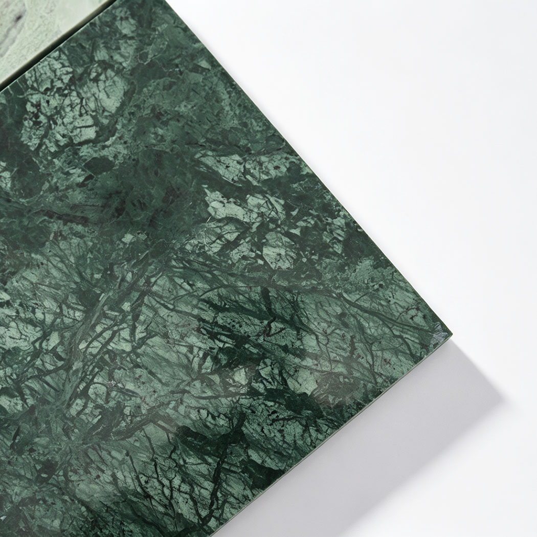 Dark green marble close-up from light and dark green checkerboard mosaic tile